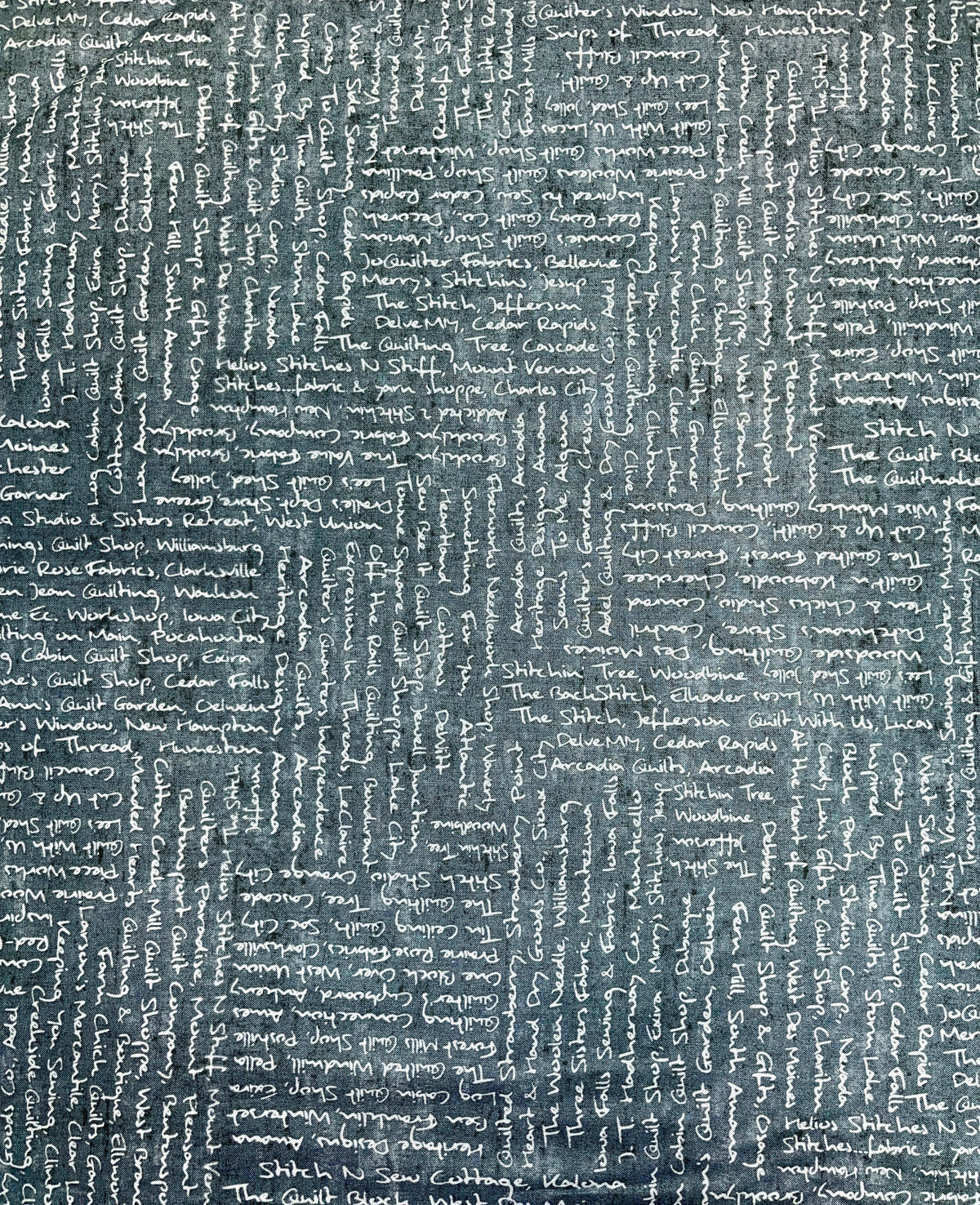 2018 All Iowa Shop Hop Fabric Shop Names and Cities Words of Gray Blue Background